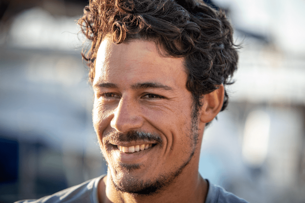 Closeup portrait candid shot of Velotrade skipper Brieuc Lebec.