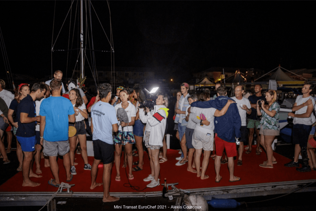 Velotrade skipper Brieuc is being interviewed after finishing the Mini Transat 2021 race. After over 16 days at sea, Brieuc finally meets his family and friends.